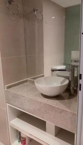 a bathroom with a large white bowl on a counter at Ojo Turco Monoambiente Temporario in Santiago del Estero