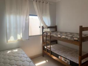 Postel nebo postele na pokoji v ubytování Linda Casa com piscina Aquecida e área de lazer + 40 fotografií