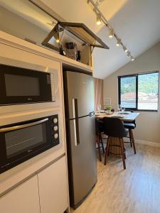 Η κουζίνα ή μικρή κουζίνα στο Apartamento wiithhoeftf