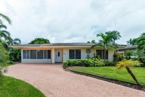 a house with a driveway in front of it at Pompano Beach Hideaway with Fenced Yard & BBQ in Pompano Beach +22 photos