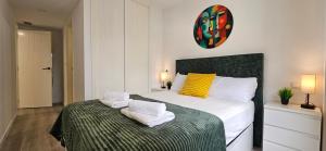 a bedroom with a bed with towels on it at Apartment Oceana - Luxury Sea View Beach Apartment in Calpe +44 photos