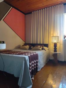 Ένα ή περισσότερα κρεβάτια σε δωμάτιο στο Casa chácara José Raydan +13 φωτογραφίες