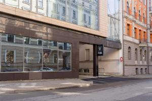 a building with windows on the side of a street at Radisson Blu Latvija Conference & Spa Hotel, Riga in Rīga