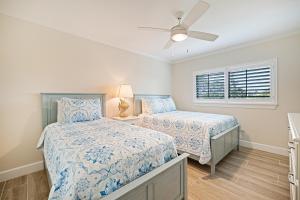 Ένα ή περισσότερα κρεβάτια σε δωμάτιο στο Coquina Beach 1C +28 φωτογραφίες