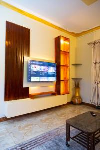 TV a/nebo společenská místnost v ubytování 3G PADRE PIO SUITEs + 4 fotografie