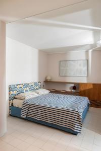 a bedroom with a large bed in a room at Certosa Luxury Apartment in Capri