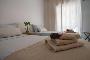 Postel nebo postele na pokoji v ubytování Joan Serenity Apartment