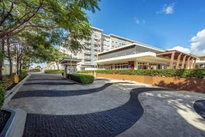 a walkway in front of a building at 1BR Condo with Free Parking at SMDC Trees Residences, Fairview Quezon City in Manila