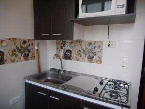 Η κουζίνα ή μικρή κουζίνα στο CYM Arriendos 1605