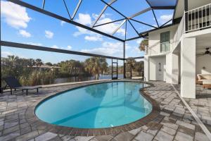 a swimming pool in the middle of a house at Club Red in Sanibel