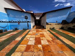 a mural on the side of a building at CASA BRANCA - Jijoca de Jericoacoara in Jijoca de Jericoacoara