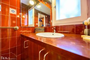a bathroom with a sink and a mirror at Casa Maria Sol- jardín I vistas al mar I 4 habitaciones I parking I BBQ in Cadaqués +33 photos