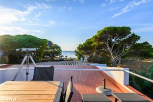 a view of the ocean from the balcony of a house at Casa Maria Sol- jardín I vistas al mar I 4 habitaciones I parking I BBQ in Cadaqués