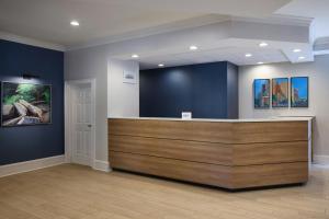 a lobby with a reception desk in a building at Residence Inn by Marriott Raleigh Crabtree Valley in Raleigh