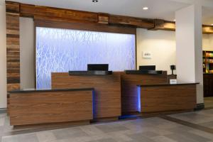 a lobby with a large screen in a building at Fairfield by Marriott Inn & Suites Chattanooga in Tyner