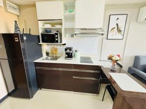 Dapur atau dapur kecil di MBC Condotel Maikhao beach +1 gambar