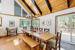 a dining room with a wooden table and chairs at Hot Tub, Game Room & Home Gym: Serene Arnold Gem in Arnold