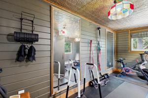 a gym with exercise bikes in a room at Hot Tub, Game Room & Home Gym: Serene Arnold Gem in Arnold