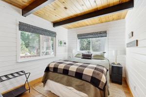 a bedroom with a bed and a window at Hot Tub, Game Room & Home Gym: Serene Arnold Gem in Arnold