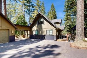 a house with a garage and a driveway at Hot Tub, Game Room & Home Gym: Serene Arnold Gem in Arnold