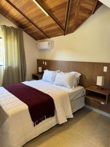 Ένα ή περισσότερα κρεβάτια σε δωμάτιο στο Loft Veneza