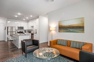 a living room with a couch and a table at BCA Furnished Apartments in Atlanta
