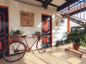 a bike parked in front of a building at Finca La Coqueta Coffee Farm in Filandia