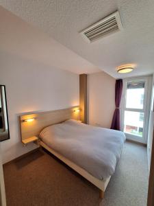 Ένα ή περισσότερα κρεβάτια σε δωμάτιο στο Appartement t3 +6 φωτογραφίες