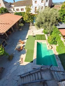 an overhead view of a swimming pool in a yard at La Festa Dels Sentits, Casa Rural in Sant Martí de Maldá