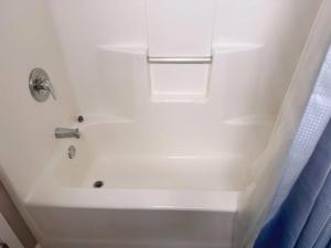 a white bath tub with a sink and a shower at Playhouse Square Downtown, Rock Hall, Clinic, CSU in Cleveland +13 photos
