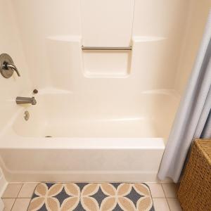 a white bath tub in a bathroom with a shower curtain at Playhouse Square Downtown, Rock Hall, Clinic, CSU in Cleveland