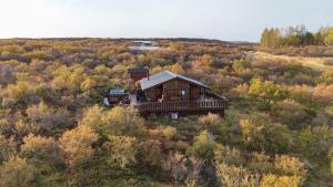 an aerial view of a house in the middle of a field at Stunning Cabin with Breathtaking Views! in Borgarnes