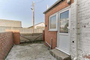 Bygningen som lejligheden ligger i + 1 billede