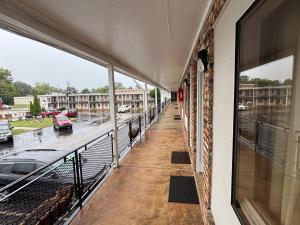 an empty balcony with a view of a parking lot at Hotel O Haven Inn Huntsville AL US 72 in Huntsville