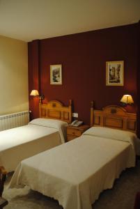 מיטה או מיטות בחדר ב-Hotel Alegría