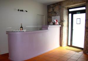 a kitchen with a white counter in a room at Casa de Campo Patio do Avô - Varanda do Pátio in Routar +74 photos