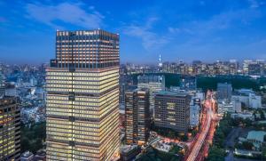 a tall building in a city at night at The Prince Gallery Tokyo Kioicho, a Luxury Collection Hotel in Tokyo