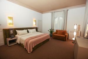 Postel nebo postele na pokoji v ubytování Padam Boutique Hotel
