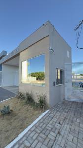 a building with a large window on the side of it at Refúgio de Luxo in Montes Claros