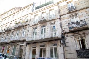 a large building with balconies on the side of it at Apartamento Boutique/Progreso in Vigo