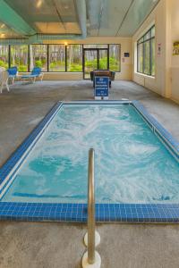 a large pool of water in a large room at Sea Mist Resort in Mashpee +22 photos
