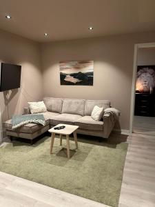 a living room with a couch and a table at Central apartment from 2025 in Alta