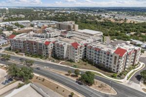 an aerial view of a city with buildings and a road at Modern Luxe Oasis, Rooftop Pool, Near Austin in Georgetown