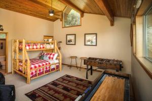 a bedroom with a bunk bed and a table at A-frame, Grand Views, Hot Tub, Mins To Boone & Asu in Sugar Grove