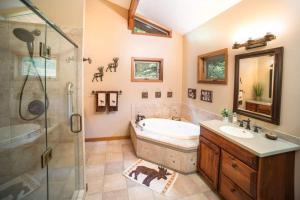 a bathroom with a tub and a sink and a shower at A-frame, Grand Views, Hot Tub, Mins To Boone & Asu in Sugar Grove +49 photos