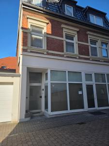 a large brick building with large glass doors at FEWO- Rafaelo2 in Marsberg