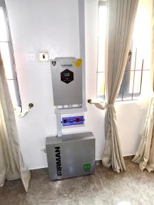 a video game machine in a room with a window at Luxury 1BR apartment with free wifi in Lagos +3 photos
