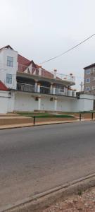 an empty street in front of a building at EvP in Kumasi