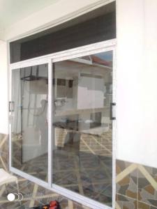 a sliding glass door in a room at EvP in Kumasi