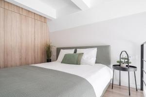 Postel nebo postele na pokoji v ubytování Loft 10